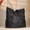 Black Leather Shoulder Bag with Adjustable Strap and Make-up Bag